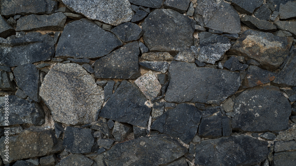 Natural stone wall texture. Medieval masonry. Ancient wall. Stone brick wall. Macro texture. Medieval architecture. Rough masonry. Background texture. Natural stone wall texture. Medieval masonry. Ancient wall. Stone brick wall. Macro texture. Medieval architecture. Rough masonry. Background texture.