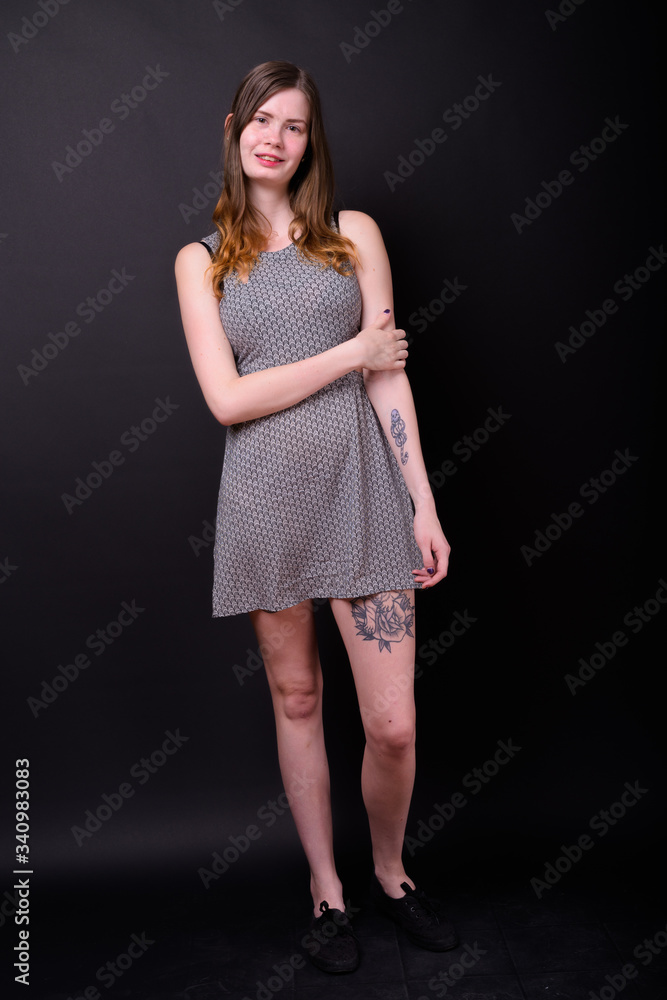 Full body shot of happy young beautiful Scandinavian woman Full body shot of happy young beautiful Scandinavian woman
