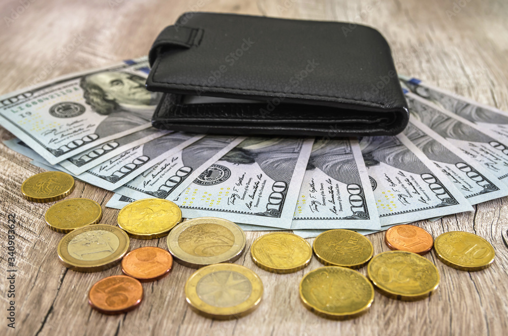 black men's wallet and money on a wooden table. black men's wallet and money on a wooden table.