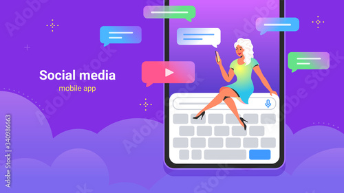 People using social media for chatting, sharing videos and subscribing. Concept vector illustration of young woman sitting on big digital keyboard and using smartphone mobile app for texting to friend