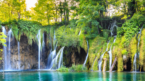 Close up of blue waterfalls in a green forest during daytime in Summer.Plitvice lakes  Croatia