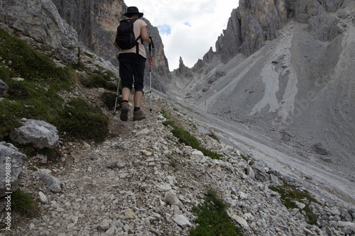 Woman's crossing via via ferrata in the alps