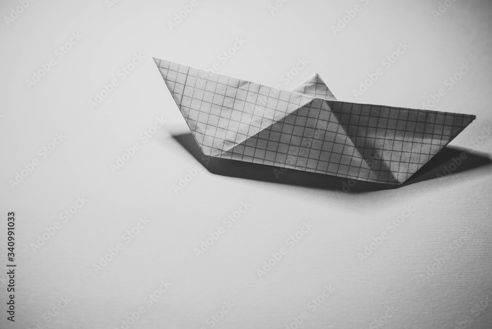 Paper boat on multicolored backgrounds Paper boat on multicolored backgrounds