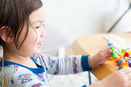 Toddler Girl Playing With Easter Toys