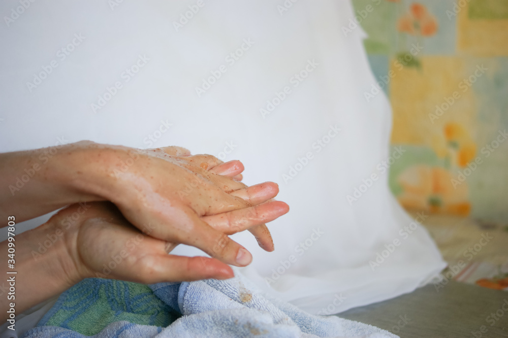 Woman doing hand peeling at home close-up Woman doing hand peeling at home close-up