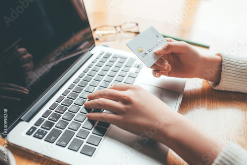 A young woman makes an online payment for a purchase. Online shopping.