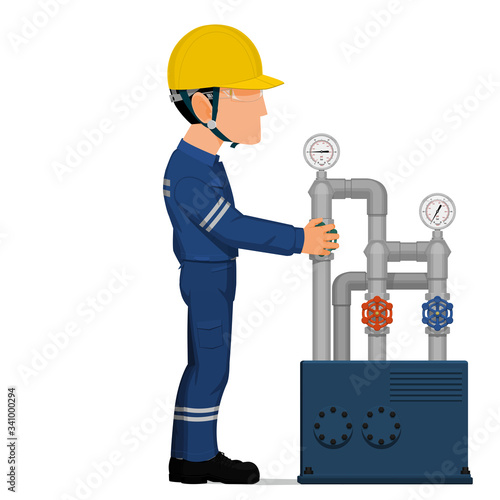 An industrial worker is turning on the valve