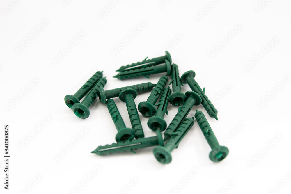 green dowels on a white background green dowels on a white background