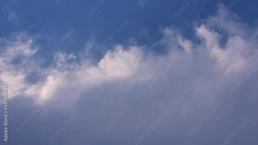 Blue sky and fuffy stratocumulus clouds are in day day just before rain. the weather appeared half cloudy than sunny. Blue sky and fuffy stratocumulus clouds are in day day just before rain. the weather appeared half cloudy than sunny.