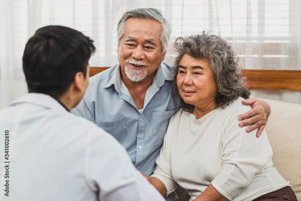 Rear view of Doctor Give advice to couple Asian grandparent patient in house, service Life insurance at home, health care with Long live and Elderly society, covid19 outbreak social distancing concept