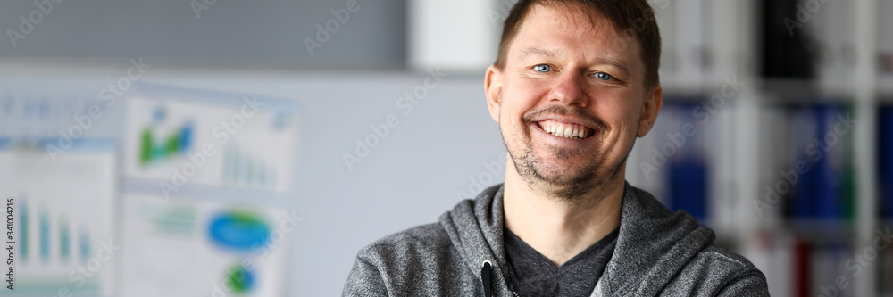 Fototapeta premium Happy man in casual wear is standing and smiling