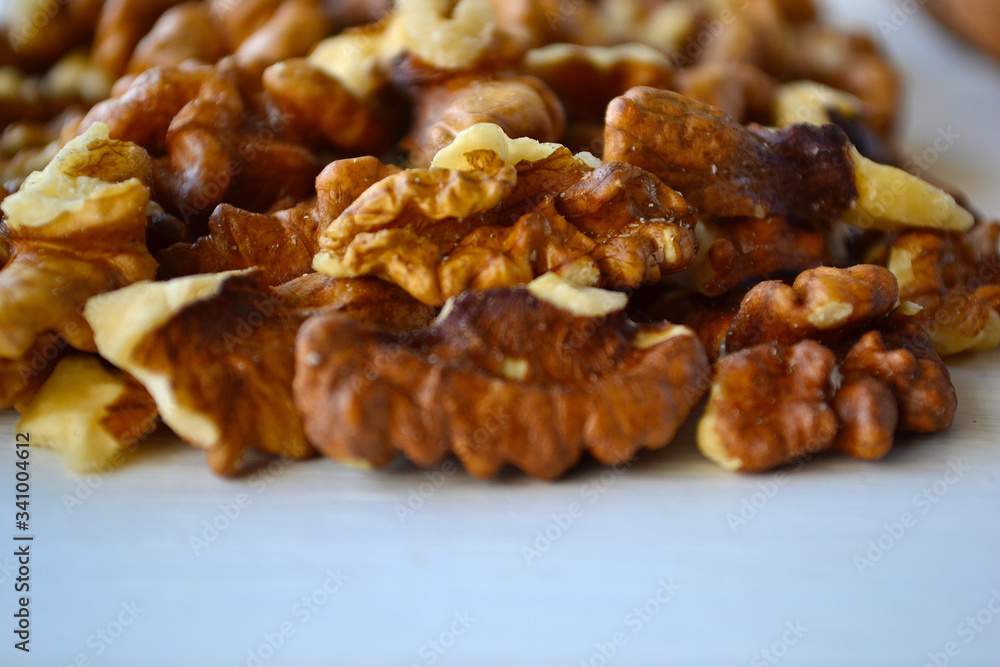 Walnuts on a white wooden background. Walnuts on a white wooden background.