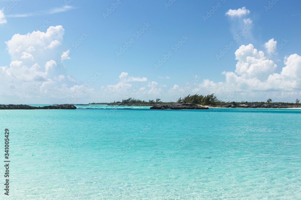 Blue ocean and white sand beach and turquoise water on Bahamas. Amazing backgrounds.