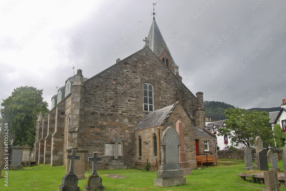 Fototapeta premium The former church of Moulin, built in 1873, and graveyard. Near Pitlochry, Scotland. The church is now a Heritage centre. UK, Europe.