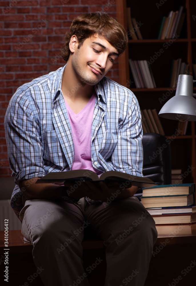 Young handsome student preparing for exams at night Young handsome student preparing for exams at night