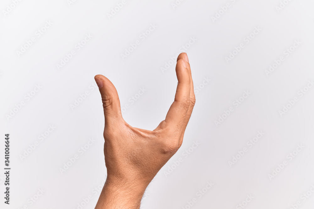 Hand of caucasian young man showing fingers over isolated white background picking and taking invisible thing, holding object with fingers showing space Hand of caucasian young man showing fingers over isolated white background picking and taking invisible thing, holding object with fingers showing space