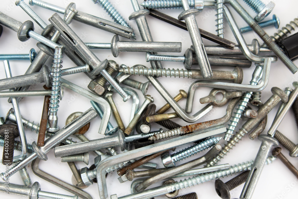 bolts and nuts on a white background in a heap bolts and nuts on a white background in a heap