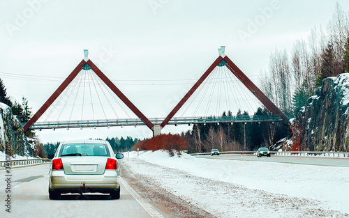 Car at winter road in Rovaniemi in Lapland Finalnd reflex photo