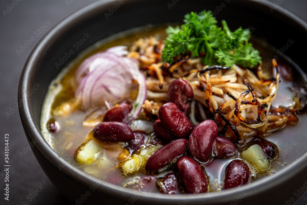 Bean soup with smoked pork, potatoes, herbs, onion Bean soup with smoked pork, potatoes, herbs, onion