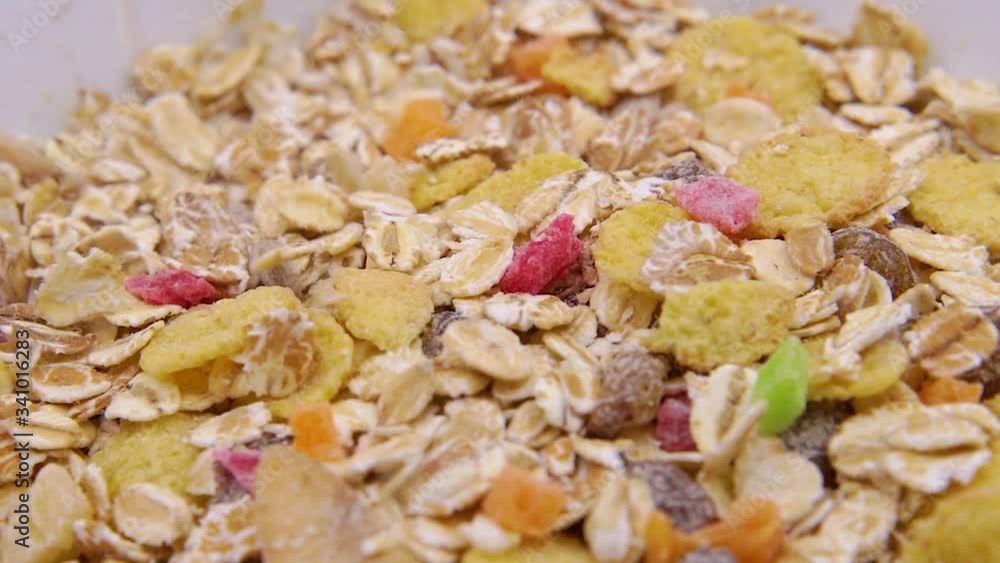 Close-up of muesli poured in a white bowl Close-up of muesli poured in a white bowl