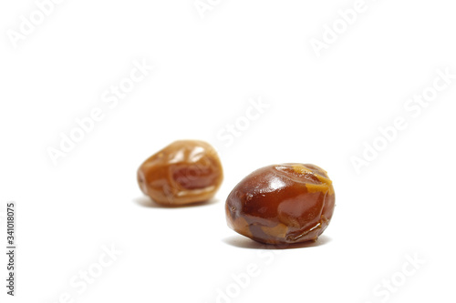 Two pieces of sukkari dates (kurma sukari) isolated on white background, perfect for breakfasting during ramadan