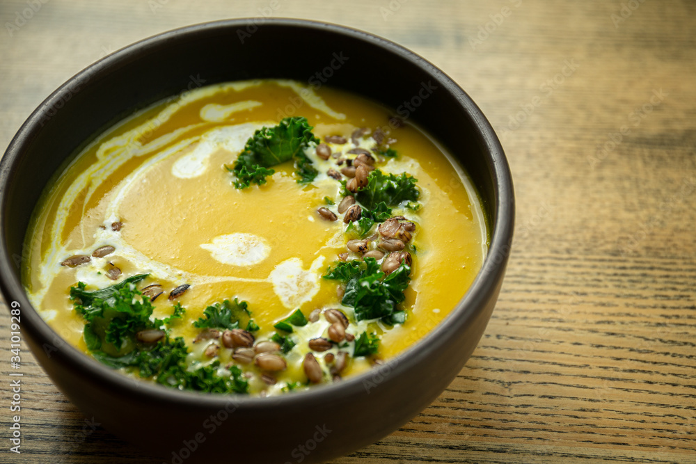 Pumpkin and kale cream soup with sweet cream Pumpkin and kale cream soup with sweet cream