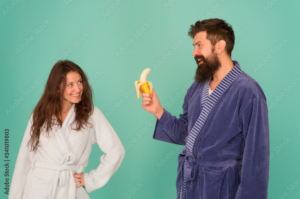 Sharing food. Healthy food. Food for health. Healthy breakfast. Couple sleepy faces domestic clothes eat banana. Couple in love bathrobes. Advice relationships surviving quarantine. Morning routine Sharing food. Healthy food. Food for health. Healthy breakfast. Couple sleepy faces domestic clothes eat banana. Couple in love bathrobes. Advice relationships surviving quarantine. Morning routine