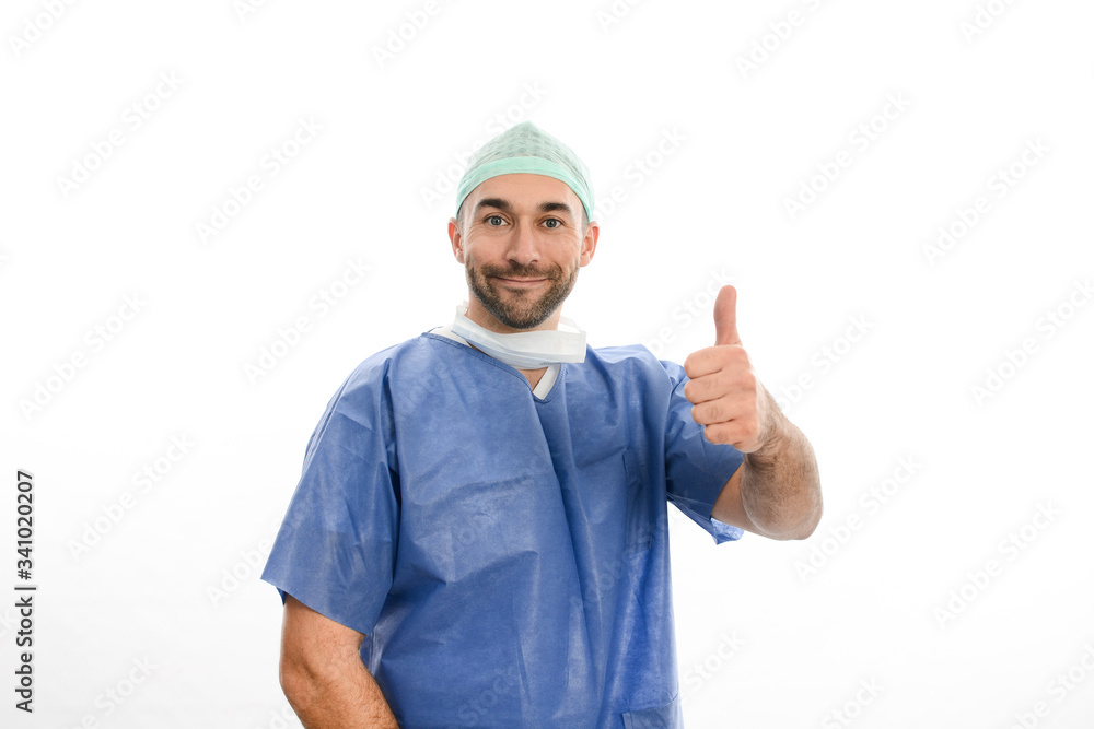 portrait of an handsome man male surgeon wearing surgical scrub suit studio shot isolated on white background