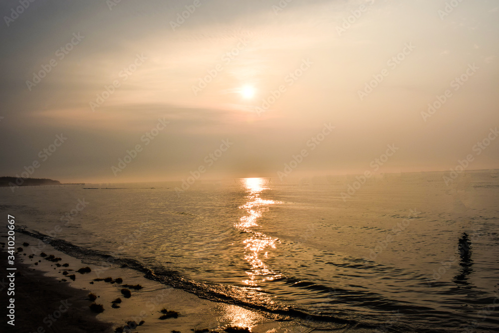 Sunrise in the beautiful ocean with the suns reflection in the ocean water