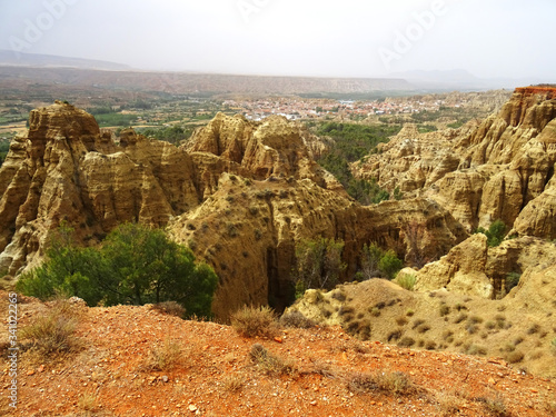 Badlands landscape between the villages of Marchal and Purullena. Guadix region. Province of Granada. Andalusia. South Spain  photo