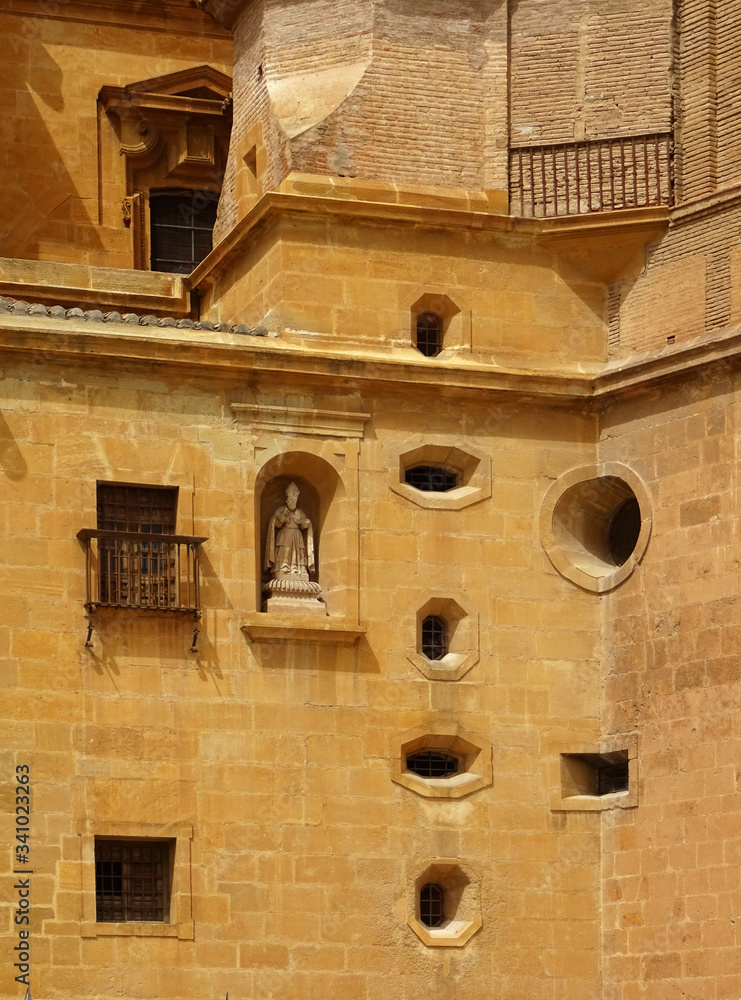 Detail of facade with different shape windows of the staircase. Cathedral of Guadix. Granada. Spain. 