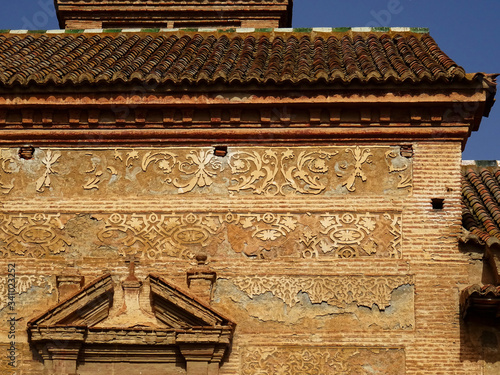 Windows and old plaster decoration of baroque façade. Concepcionistas Monastery in the old city center of Guadix. Spain.  photo