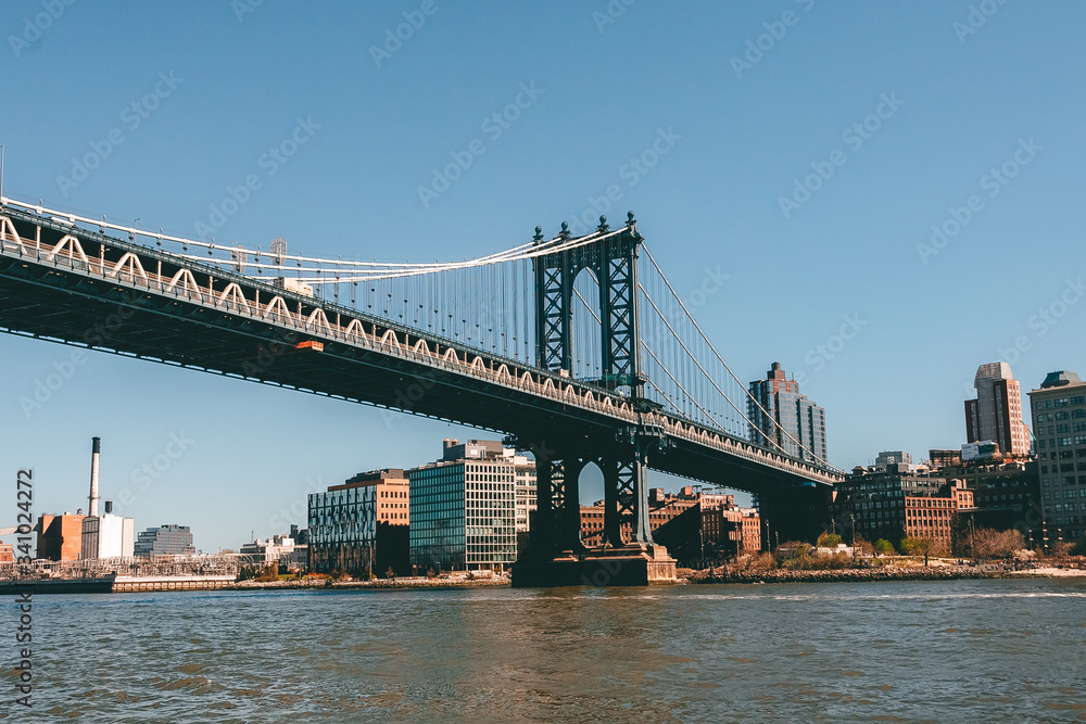 New York City, NY, USA - 04/20/2019: Manhattan bridge view from boat