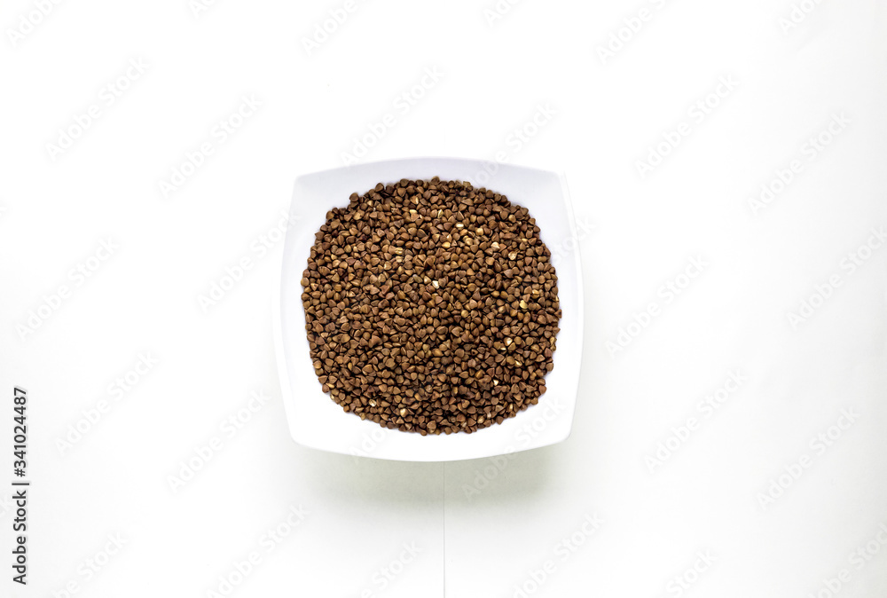 close up of white cup of buckwheat layout on white isolated background. asian food and kitchen concept with copy space close up of white cup of buckwheat layout on white isolated background. asian food and kitchen concept with copy space