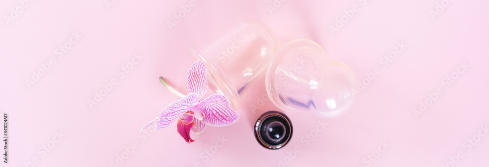 Vacuum cans for body on pink background. Rubber equipment for anti cellulite massage. Vacuum cans for body on pink background. Rubber equipment for anti cellulite massage.