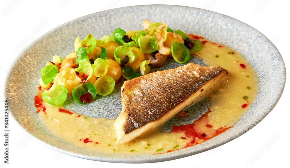 Grilled sea bass fillet with vegetable garnish Grilled sea bass fillet with vegetable garnish