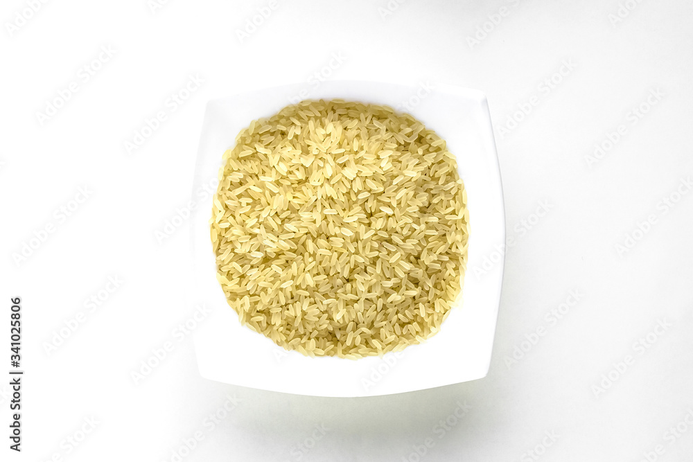 close up of white cup white rice layout on white isolated background. asian food and kitchen concept with copy space