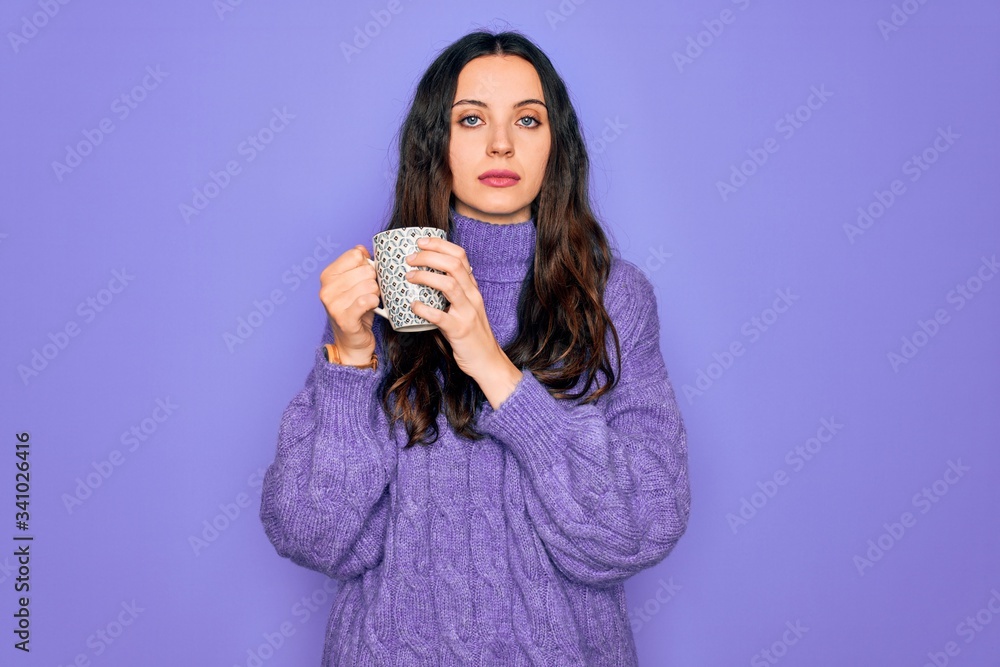 Young beautiful woman with blue eyes drinking mug of coffee over isolated purple background with a confident expression on smart face thinking serious Young beautiful woman with blue eyes drinking mug of coffee over isolated purple background with a confident expression on smart face thinking serious