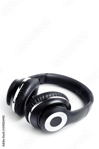 Black stylish professional wireless headphone on white background. High-quality music studio headset.