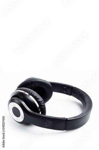 Black stylish professional wireless headphone on white background. High-quality music studio headset.