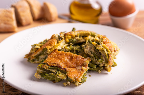 Slices of omelette with asparagus. Nutritious and quick lunch, based on proteins, good fats and vitamins.