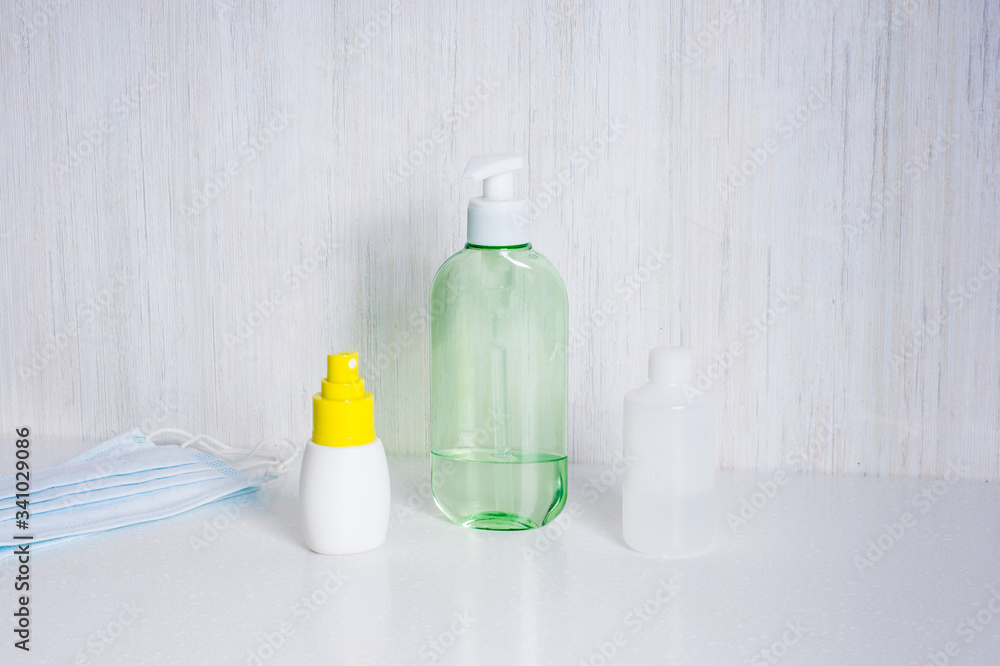 hand sanitizer gel for hand hygiene and medical surgical masks.  Preventive gear in quarantine for coronavirus. .staying home during the coronavirus pandemia.