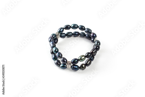 Black pearl bracelet on a white background isolate