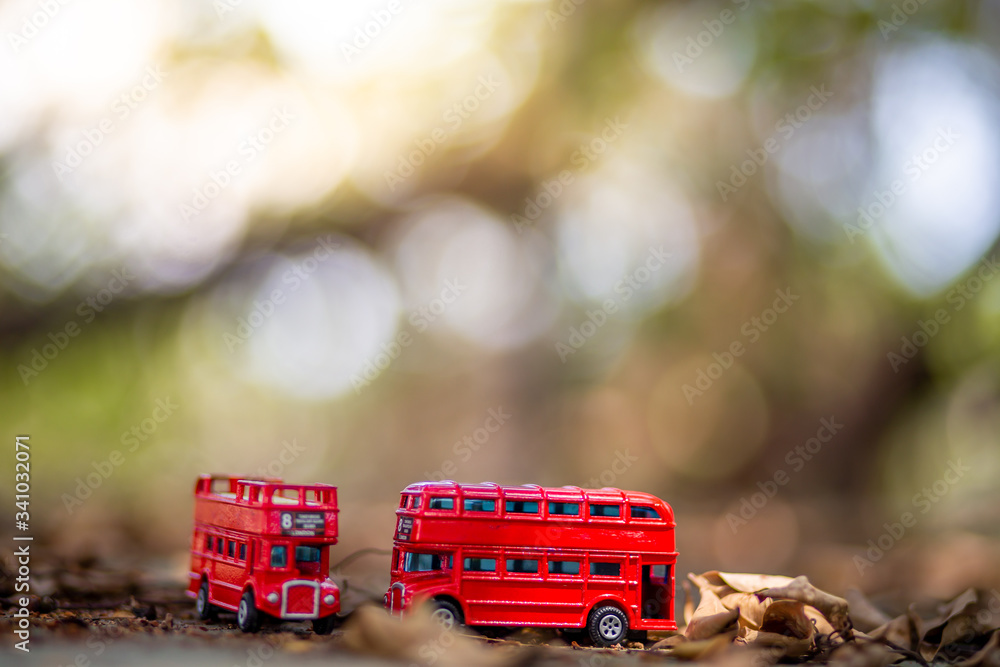 Obraz na plátně toys that represent two of the main symbols of the city of London, double-decker bus on blurred background