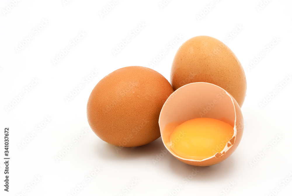 Chicken eggs and broken egg with yolk isolated on white background. Chicken eggs and broken egg with yolk isolated on white background.