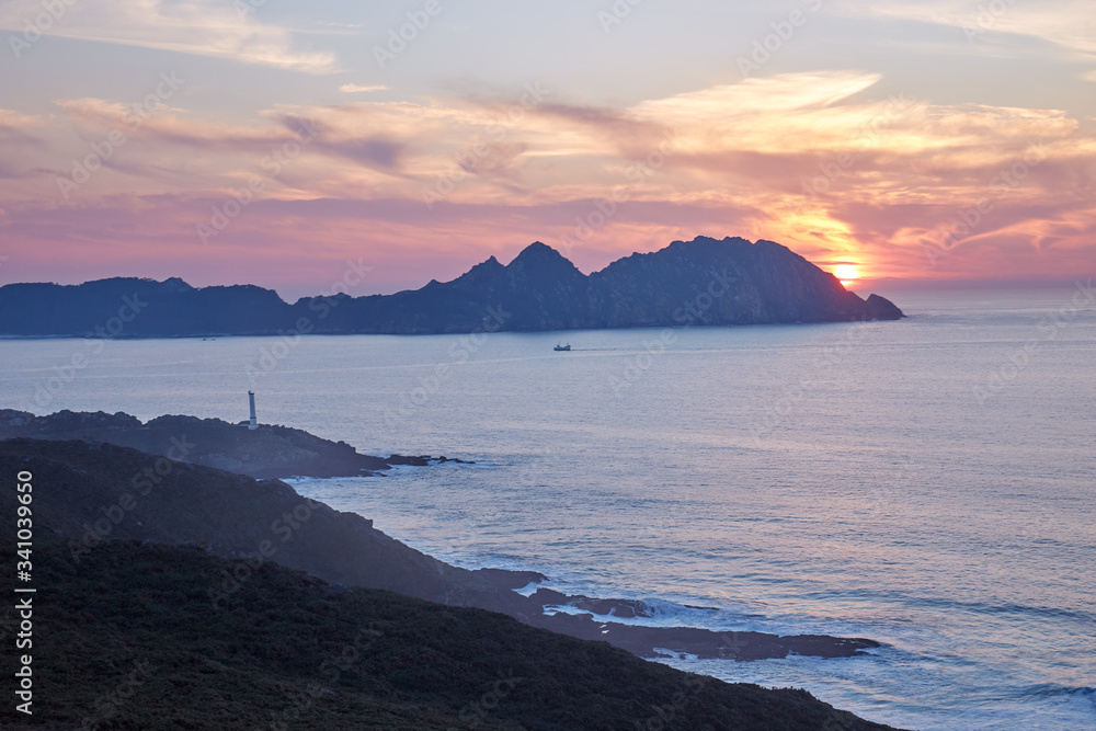 Sunset in the Cies Islands from the coast of La Vela in Galicia, Spain.
