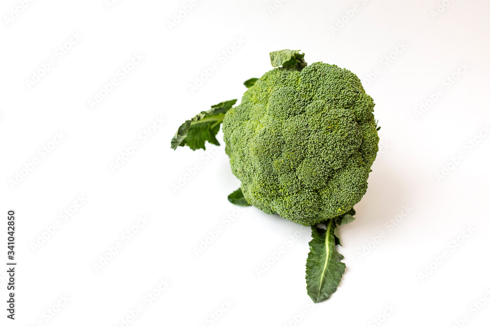 Fresh edible green broccoli plant isolated on a white background. Health food Fresh edible green broccoli plant isolated on a white background. Health food