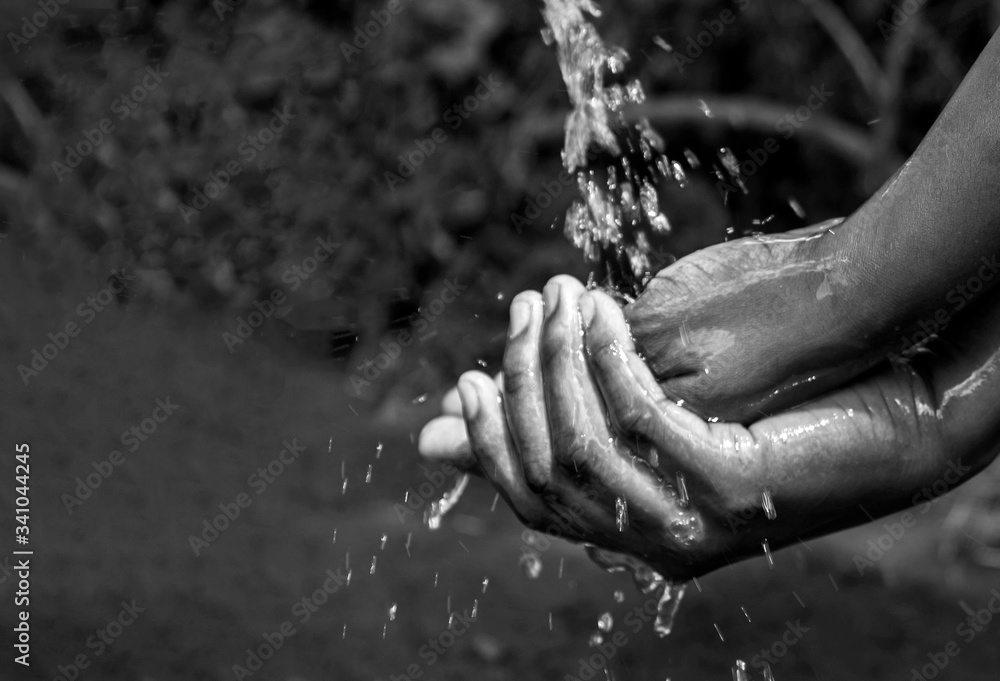 Washing hands with running water and soap. For hygiene and covid-19 prevention concepts.