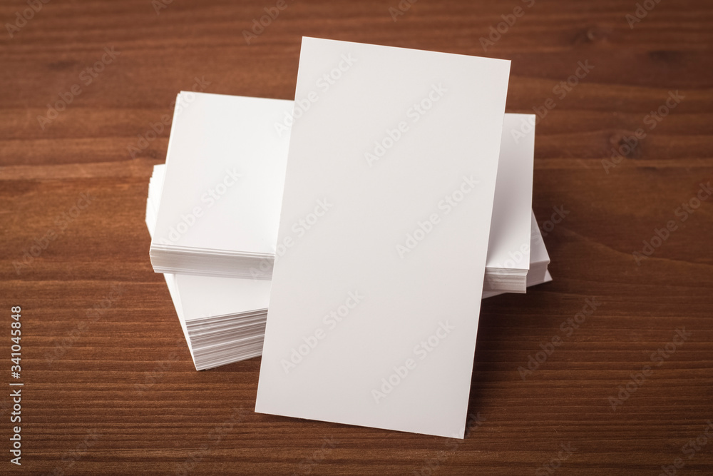 Blank business card template on a wooden table. business card for corporate identity presentation Blank business card template on a wooden table. business card for corporate identity presentation