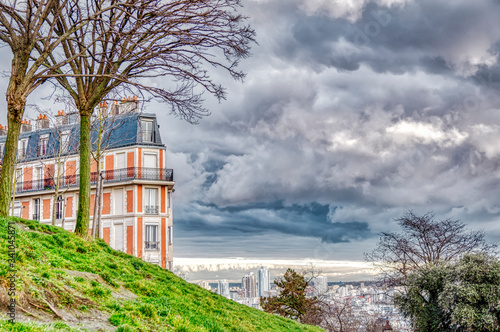 Fotografie Nice urban landscape that combines nature with a city building